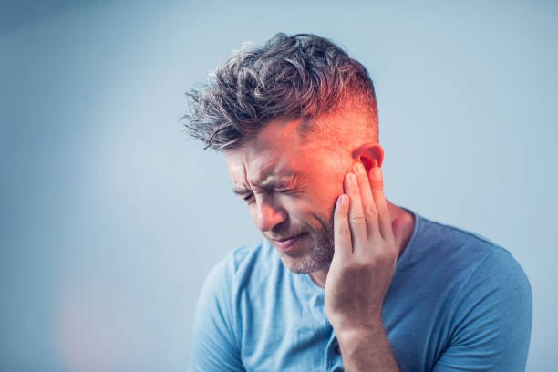 Man experiencing ear pain